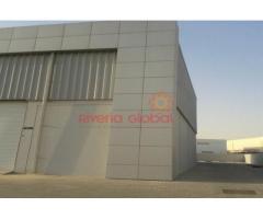 Commercial warehouse with 60,000 sq ft Openland for sale in Dubai Investment park.